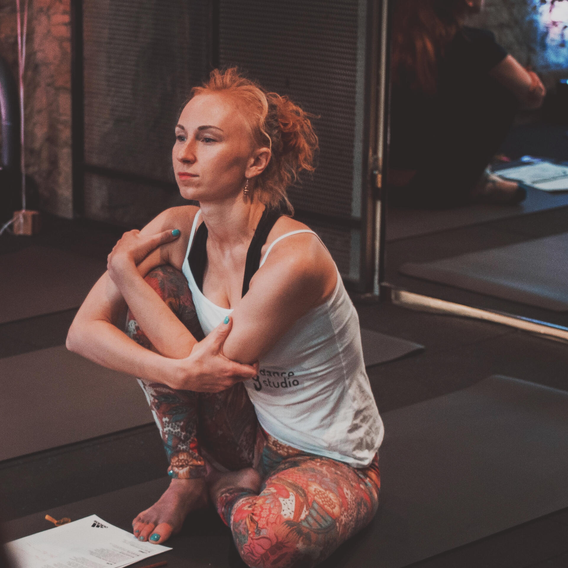 Dance Teacher Contemplating - Mindful Reflection Photo of a dance teacher sitting in contemplation, reflecting mindfully on teaching and student connection.